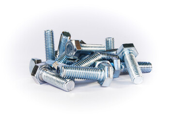 a pile of bolts with a thread and a hex head on a white background