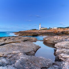 Sticker - long exposure view of the Cap de ses Salines Lighthouse on Mallorca just before sunrise