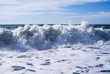 © isavira - Sea wave close-up, water splash in the sea, sea foam against the sky on a summer sunny day