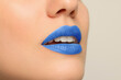 © New Africa - Woman wearing blue lipstick on light background, closeup. Space for text