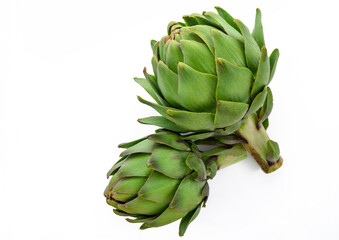 Wall Mural - two green artichokes on a white background