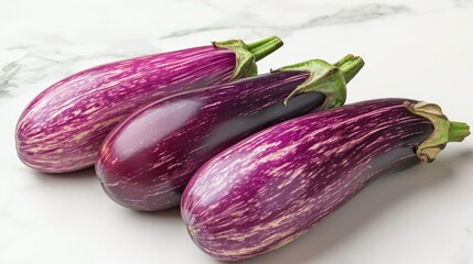 Wall Mural - Fresh eggplants are brightly displayed on the table