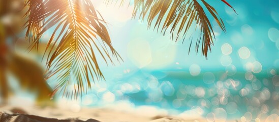 Wall Mural - Blurred Palm tree and sandy beach with tropical backdrop, representing Summer vacation and travel idea. Plenty of space for text.
