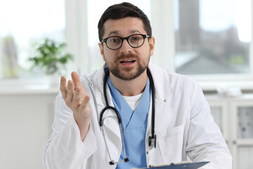 Canvas Print - Portrait of doctor with stethoscope in clinic