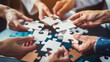 © Ayla - Business team connecting puzzle pieces, symbolizing teamwork and success in business.
