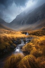 Wall Mural - Rugged beauty of an Irish mountain range, with misty waterfalls and rocky hills under dramatic skies. A small stream winds through golden grasses in front, reflecting light from dark clouds above