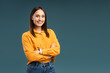 © Maria Vitkovska - Portrait of happy young woman with arms crossed, posing in studio, looking at camera
