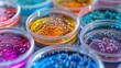 © JP STUDIO LAB - Collection of petri dishes with vividly colored bacterial colonies, representing the fascinating world of microbes in a lab setting