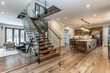 © shobakhul - A large open living room with a staircase leading to the kitchen
