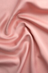 Wall Mural - Crumpled pink silk fabric as background, top view