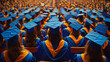 © KoralFox - Graduates in blue caps and gowns seated at a large indoor graduation ceremony