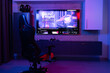 © Wavebreak Media - Gaming chair for video games in neon room with video streaming on screen, copy space