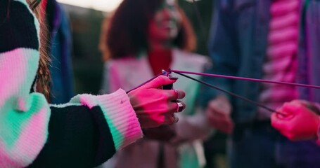 Wall Mural - Sparklers, lighter or hands of people in celebration with flame, party or sticks in night on new years. Group, closeup or friends in urban city together for social event, fun fireworks or burning