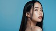© The Little Hut - Young Asian beauty woman model long hair with natural makeup look on face and perfect clean skin on isolated blue background Facial treatment Cosmetology Spa Aesthetic plastic surgery : Generative AI