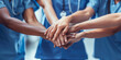 © DreamyStudio - Medical team stacking hands against