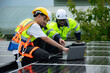 © Wosunan - Group of engineer and technician inspects solar panel installation and test the operation of the panel