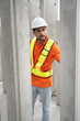 © chachamp - Portrait Hispanic latin engineer man checking precast cement at precast cement outdoor factory