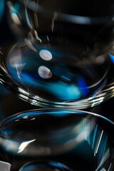 wallpaper of macro photo of clean polished glass and silver metall, edges with light from four different colors, depth of field, blurred, dark navy and dark azure, dark background, natural colors, 2:3