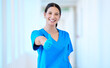 © peopleimages.com - Thumbs up, doctor and portrait of woman in hospital for celebration with surgery success and support for healthcare. Female person, medical expert and hand with yes emoji for positive test results
