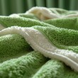 © FU - 'Luxurious Detail: Green and White Macro Shot of a Luxury Towel'