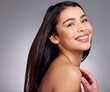 © peopleimages.com - Happy, woman and portrait for haircare in studio for growth, healthy shine and treatment transformation results. Proud, female person and smile or straight hairstyle, keratin glow and grey background