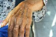 © adi yuhanggana - wrinkled elderly hands, holding hands, elderly hands