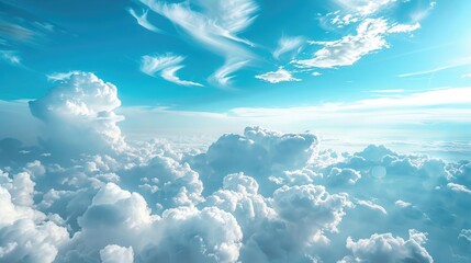 Wall Mural - Above white clouds on blue sky background close up, cumulus clouds high in azure skies, beautiful aerial cloudscape view from above.
