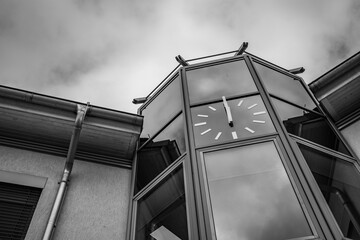 old chimes above modern glass architecture