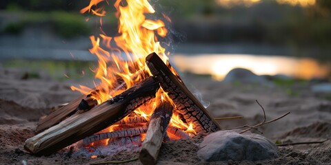 Wall Mural - Glowing campfire in nature, radiating warmth and light into the night.