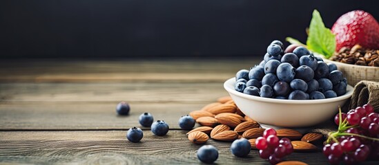 Poster - Organic breakfast filled with a variety of healthy foods like almonds bilberries fresh fruit and other nutritious vegetarian options displayed on a table with copy space image