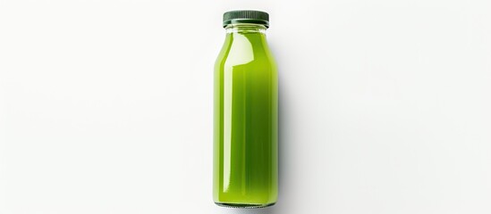 Wall Mural - a top down view of a glass bottle filled with organic green juice on a white surface ideal for addin