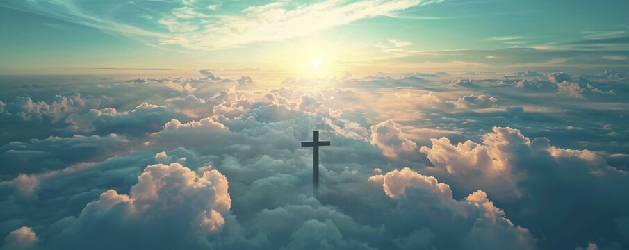 Christian cross is standing above the clouds at sunset symbolizing faith, hope and heaven