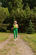 © rostyslav84 - Pretty female athlete running on a track in the park. A woman is jogging