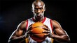 © hobonski - African American Basketball Player Holding Ball.  Portrait of a strong, muscular African American male basketball player holding an orange basketball.