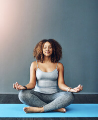 Canvas Print - Meditation, relax and woman on mat in home for mental health, mindfulness and chakra balance. Happy, female person and lotus pose with spiritual healing for holistic, inner peace and awareness