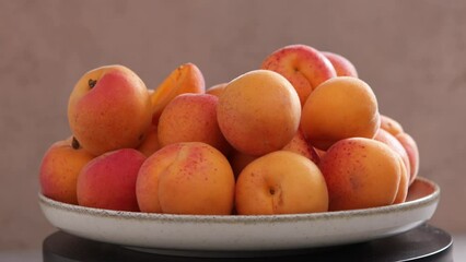 Wall Mural - ripe apricots rotation on plate fruits