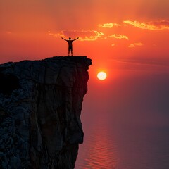 Wall Mural - Silhouetted Figure Embracing New Dawn on Cliff Edge with Outstretched Arms