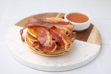 Sticker - Delicious pancakes with bacon and honey on white table, closeup