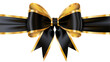 © CHONCHANOK PHOTO - Elegant black satin ribbon with a gold trim tied into a perfect bow.
