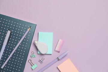 Wall Mural - Flat lay composition with notebook and different stationery on violet background