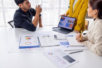 Wall Mural - Group of casually dressed asian businesspeople discussing ideas in the office. Creative professionals gathered at the meeting table for discuss important issues of the new successful startup project	