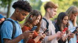 © dobok - Teenagers Engrossed Smartphones Social Media Outdoor