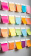 © Wonderful Studio - A wall covered in colorful sticky notes with different colors and shapes