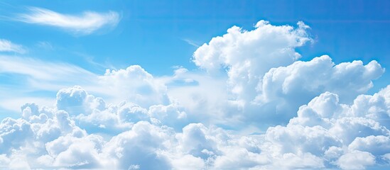 Wall Mural - white clouds on a blue sky. creative banner. copyspace image