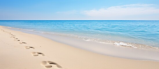 Poster - footprints in the sand on the shores of the Mediterranean. Creative banner. Copyspace image