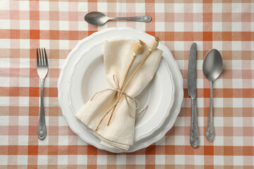 Stylish setting with cutlery and plates on table, flat lay