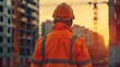 © SOUND OF RAIN - Back View of Construction Worker with Safety Helmet