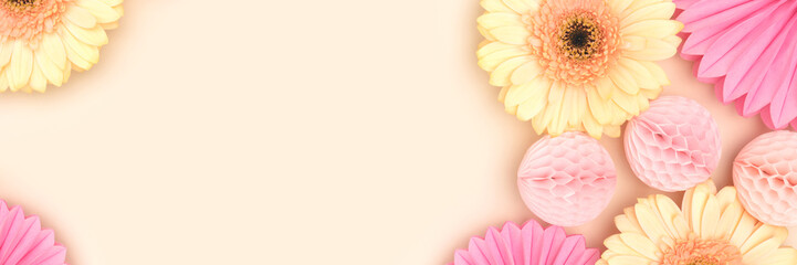 Wall Mural - gerbera flowers, pink tissue paper fans and balls on a beige background. banner with festive concept
