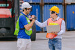 © Quality Stock Arts - Group of Port Container Ship Yard Colleague Workers working together join teamwork control operate solving problem.