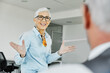 © Lumos sp - business businesswoman senior elderly office meeting woman portrait corporate manager smiling talking conversation happiness mature glasses communication discussion executive
